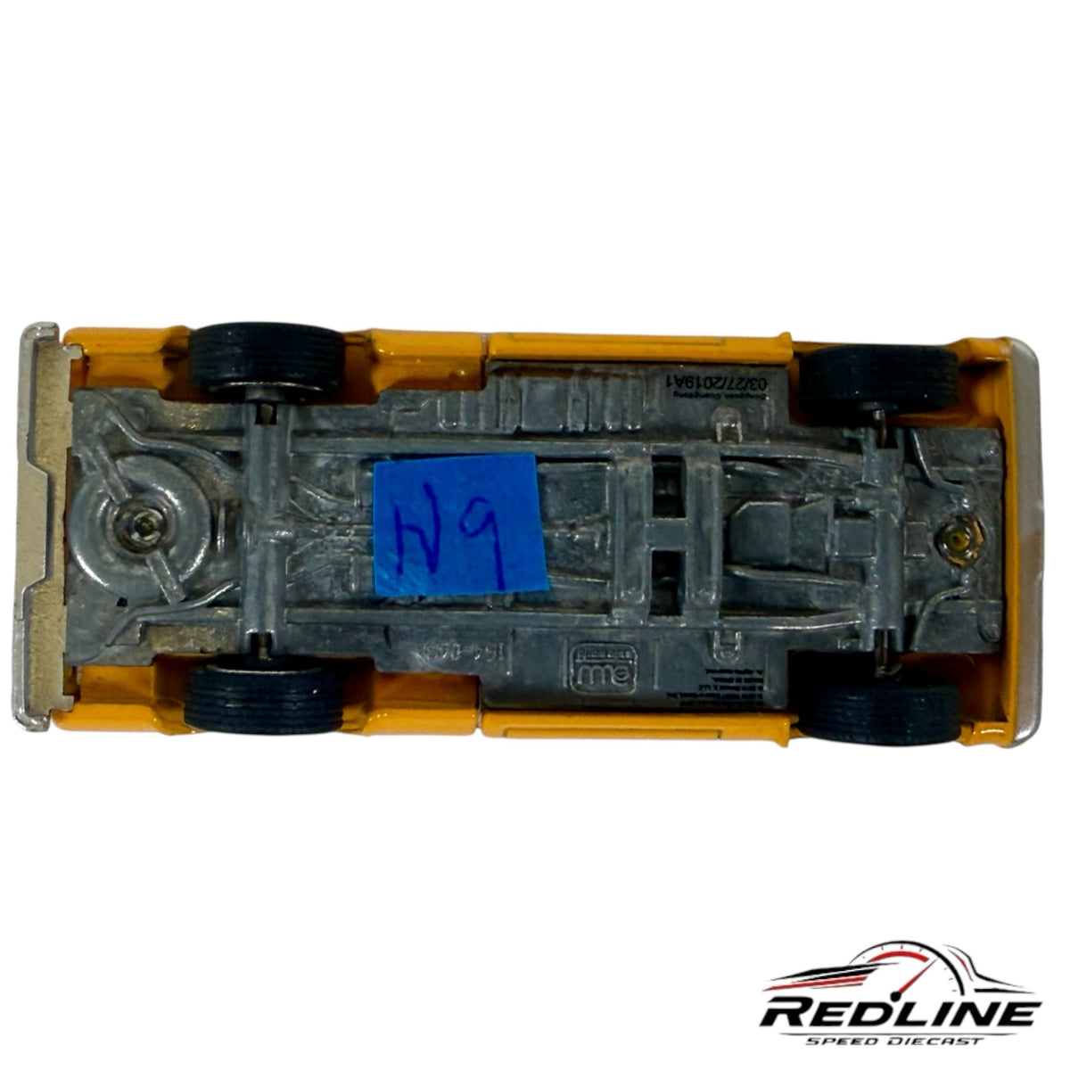 Underside view of a Redline Speed Diecast Chevrolet Cheyenne pickup truck model showing metal chassis and wheels