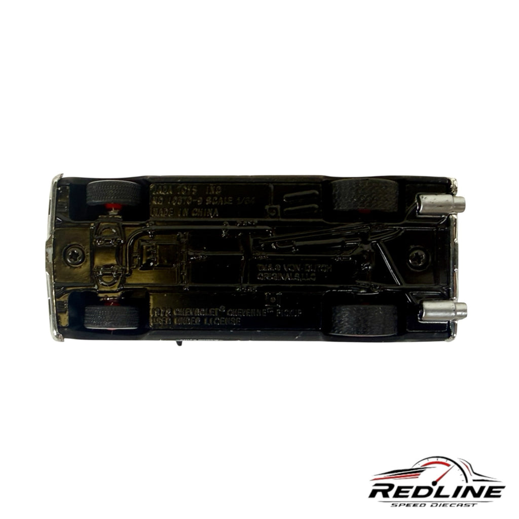 Underside view of a Redline Speed Diecast 1:64 scale 1972 Chevrolet Cheyenne pickup truck model in matte black