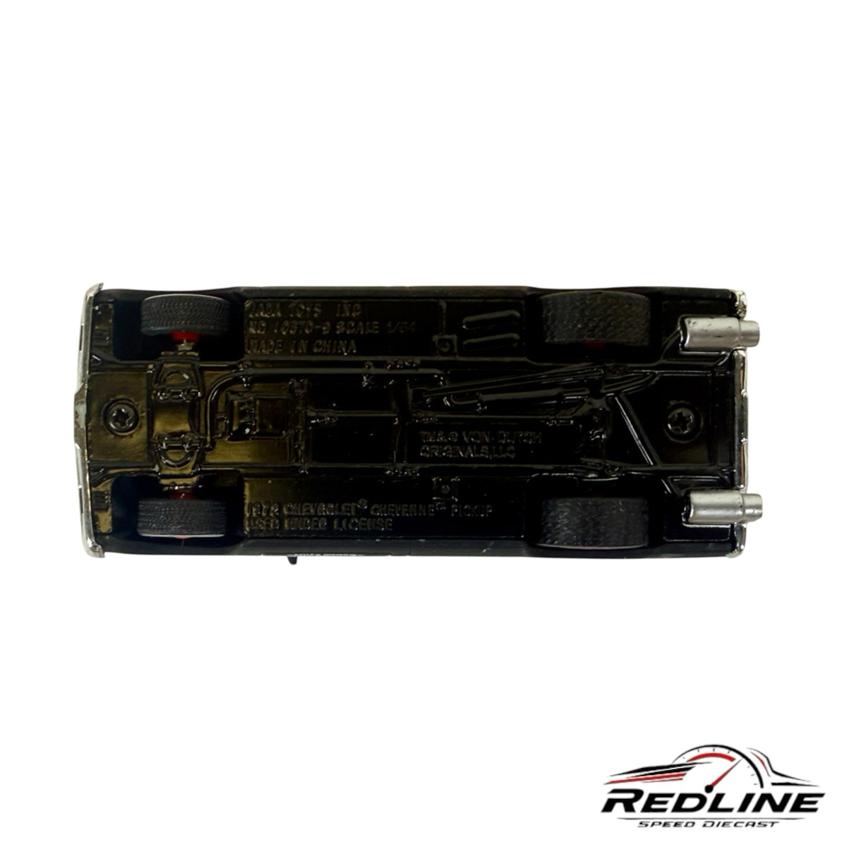Underside view of a Redline Speed Diecast 1:64 scale 1972 Chevrolet Cheyenne pickup truck model in matte black