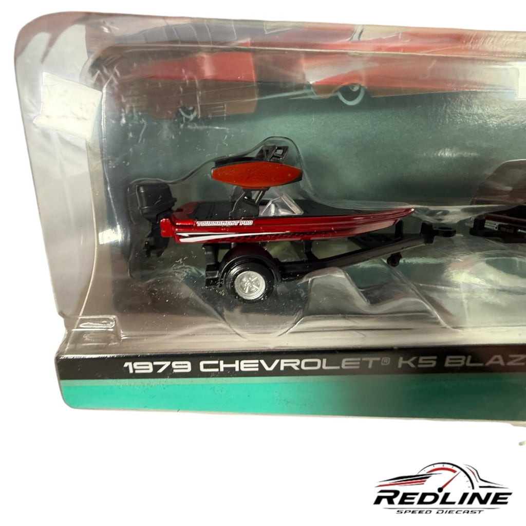 Redline Speed Diecast 1979 Chevrolet K5 Blazer set featuring a red and black ski boat on a trailer in packaging