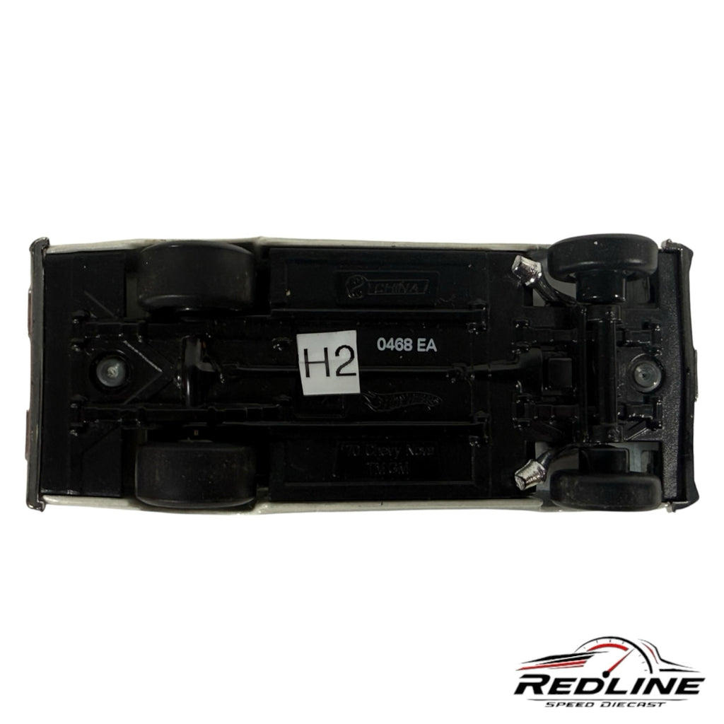 Underside view of a Redline Speed Diecast 1970 Chevrolet Nova model car showing the black chassis and wheels