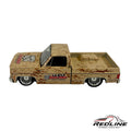 Redline Speed Diecast 1973 Chevrolet pickup model in weathered tan with Speed Dawg branding and chrome wheels