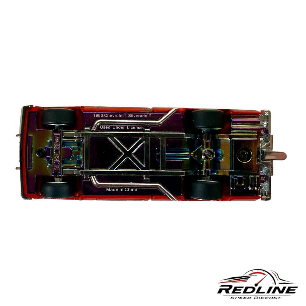 Underside view of Redline Speed Diecast Kaido House Chevrolet Silverado Clod Buster model with iridescent chassis