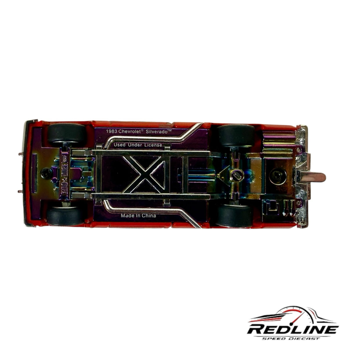 Underside view of Redline Speed Diecast Kaido House Chevrolet Silverado Clod Buster model with iridescent chassis