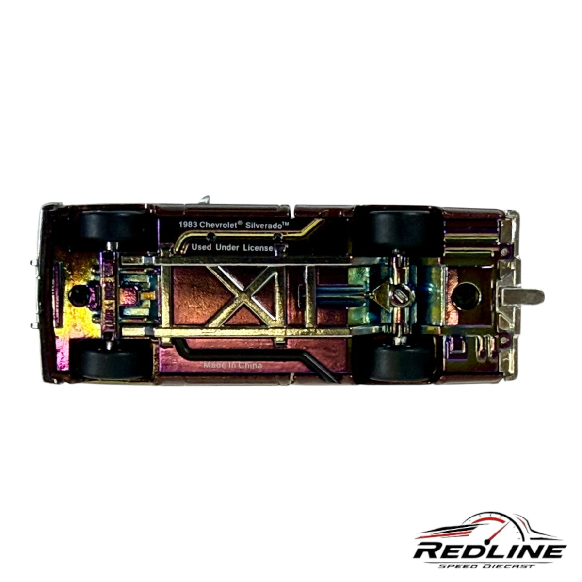 Redline Speed Diecast 1:64 scale Chevrolet Silverado model truck showing the iridescent metallic chassis underside