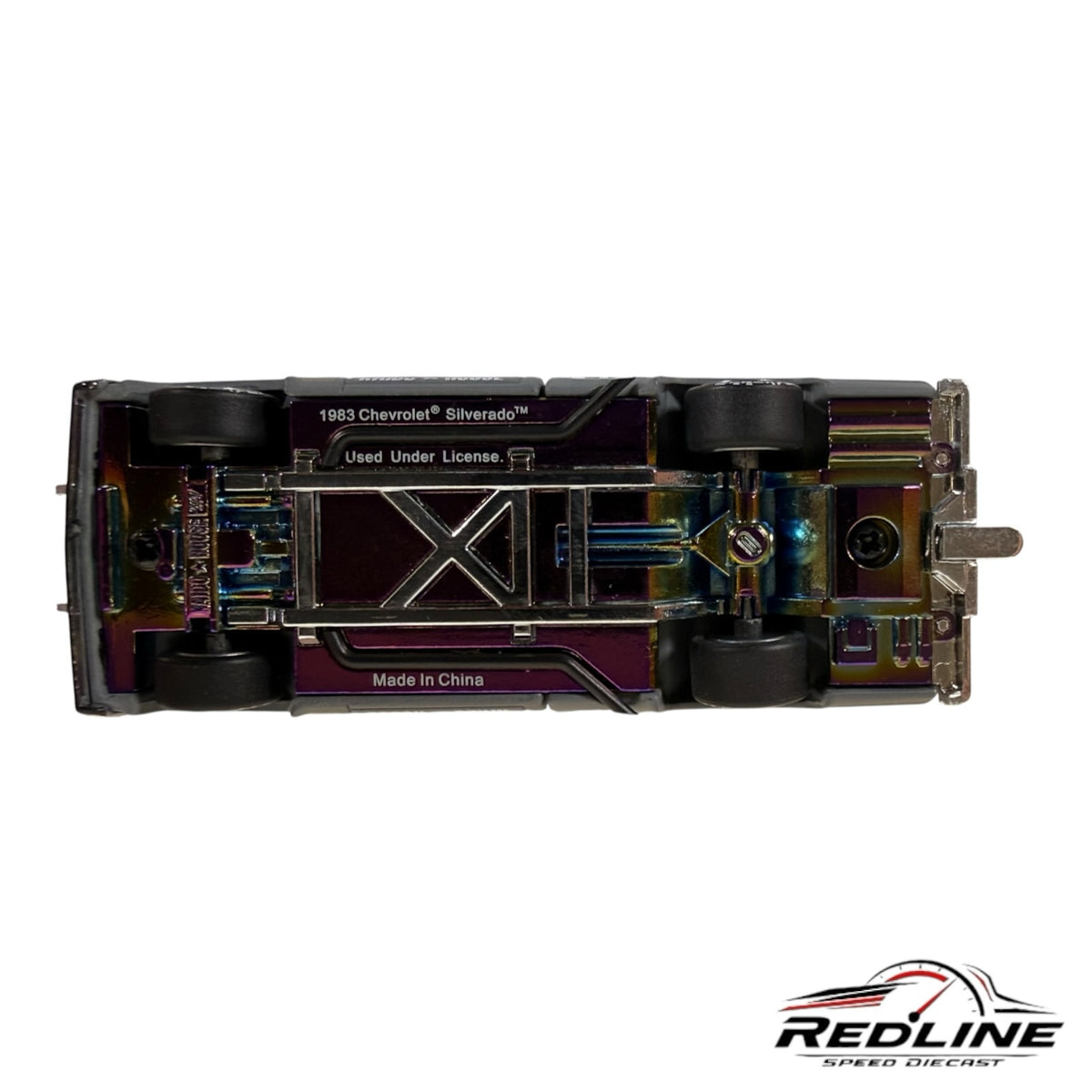 Redline Speed Diecast 1:64 scale Chevrolet Silverado model showing the iridescent metal chassis and rubber tires