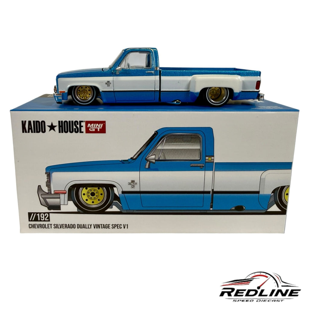 Redline Speed Diecast 1:64 scale blue and white Chevrolet Silverado Dually Vintage Spec model truck on its box.