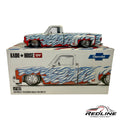Redline Speed Diecast 1:64 scale Chevrolet Silverado Dually model with white paint and red and blue flame graphics.