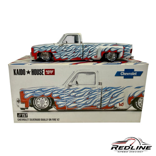Redline Speed Diecast 1:64 scale Chevrolet Silverado Dually model with white paint and red and blue flame graphics.