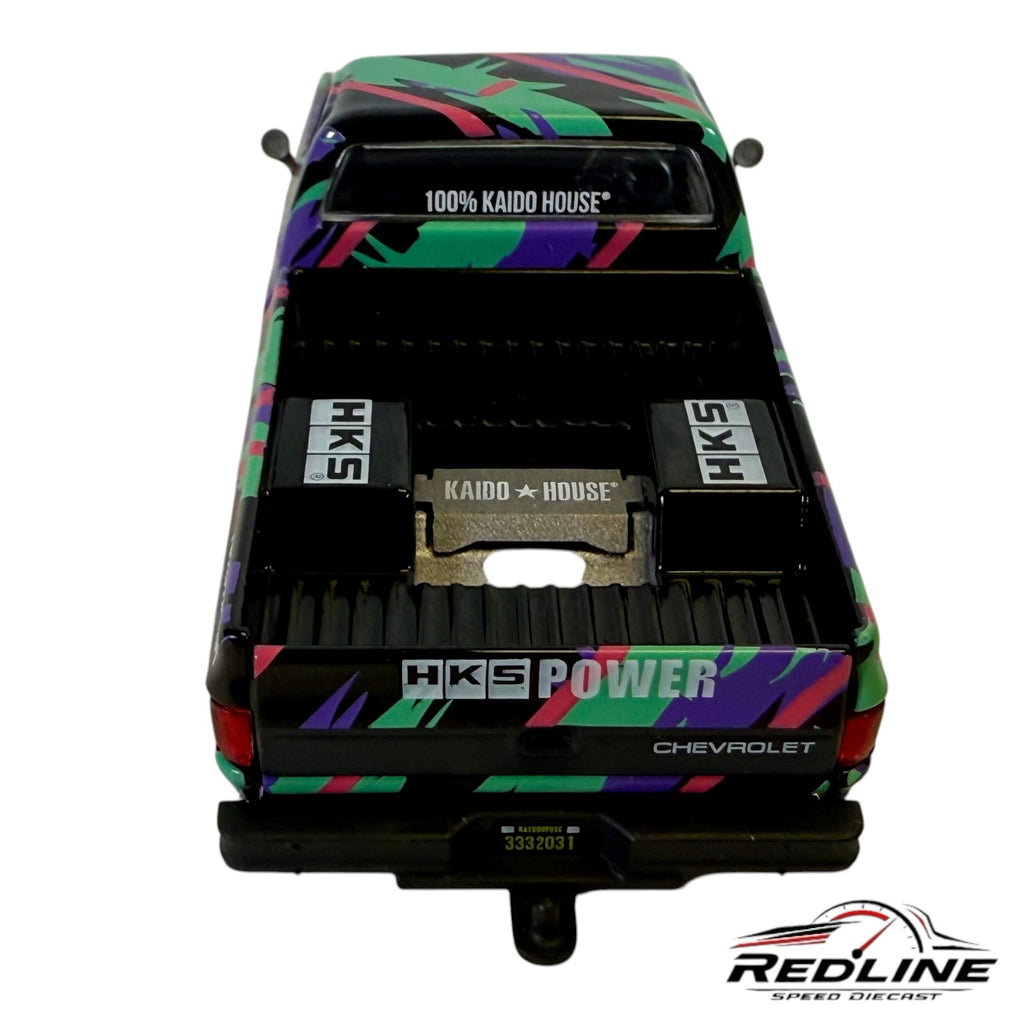 Redline Speed Diecast 1:64 scale 1983 Chevrolet Silverado HKS truck model with colorful livery and detailed truck bed