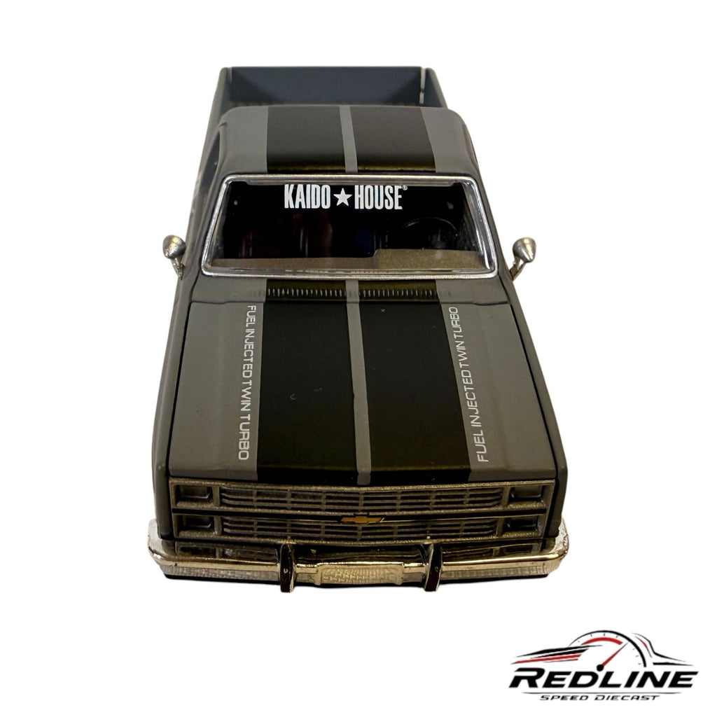 Redline Speed Diecast 1:64 scale matte grey Chevrolet Silverado pickup truck with black racing stripes and Kaido House branding