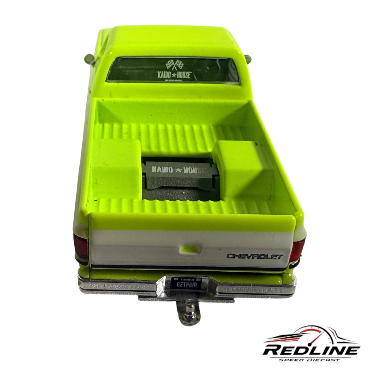 Redline Speed Diecast 1:64 scale neon green and white 1983 Chevrolet Silverado pickup truck rear view