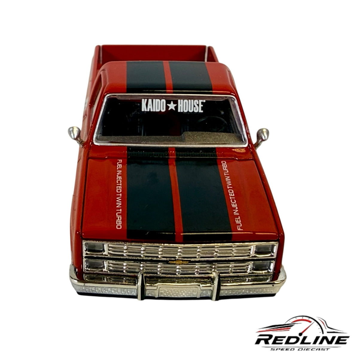 Redline Speed Diecast 1983 Chevrolet Silverado model with red paint, black racing stripes, and chrome front grille.