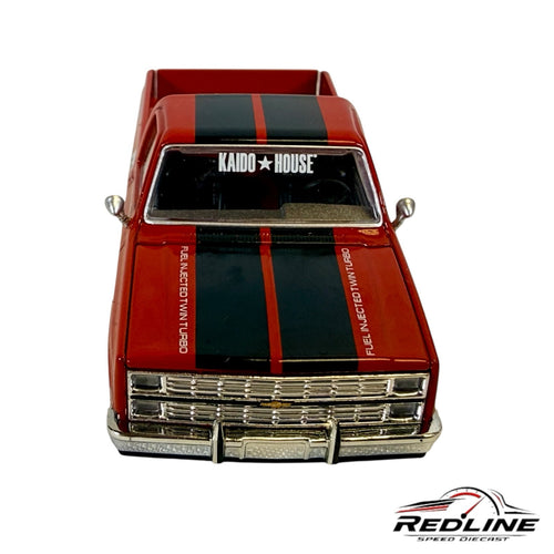 Redline Speed Diecast 1983 Chevrolet Silverado model with red paint, black racing stripes, and chrome front grille.
