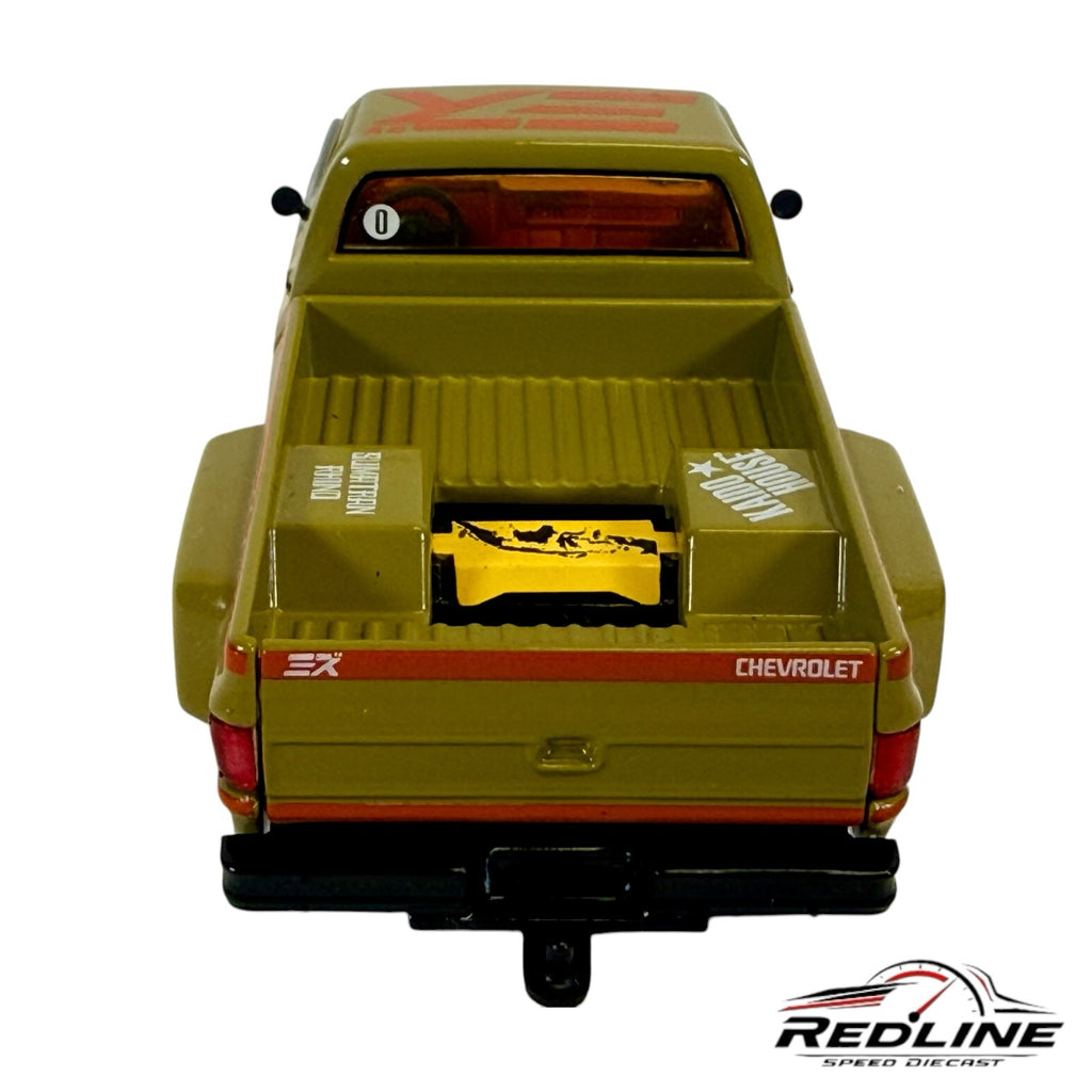 Rear view of Redline Speed Diecast 1983 Chevrolet Silverado Sumatran Rhino model truck in olive green with custom bed
