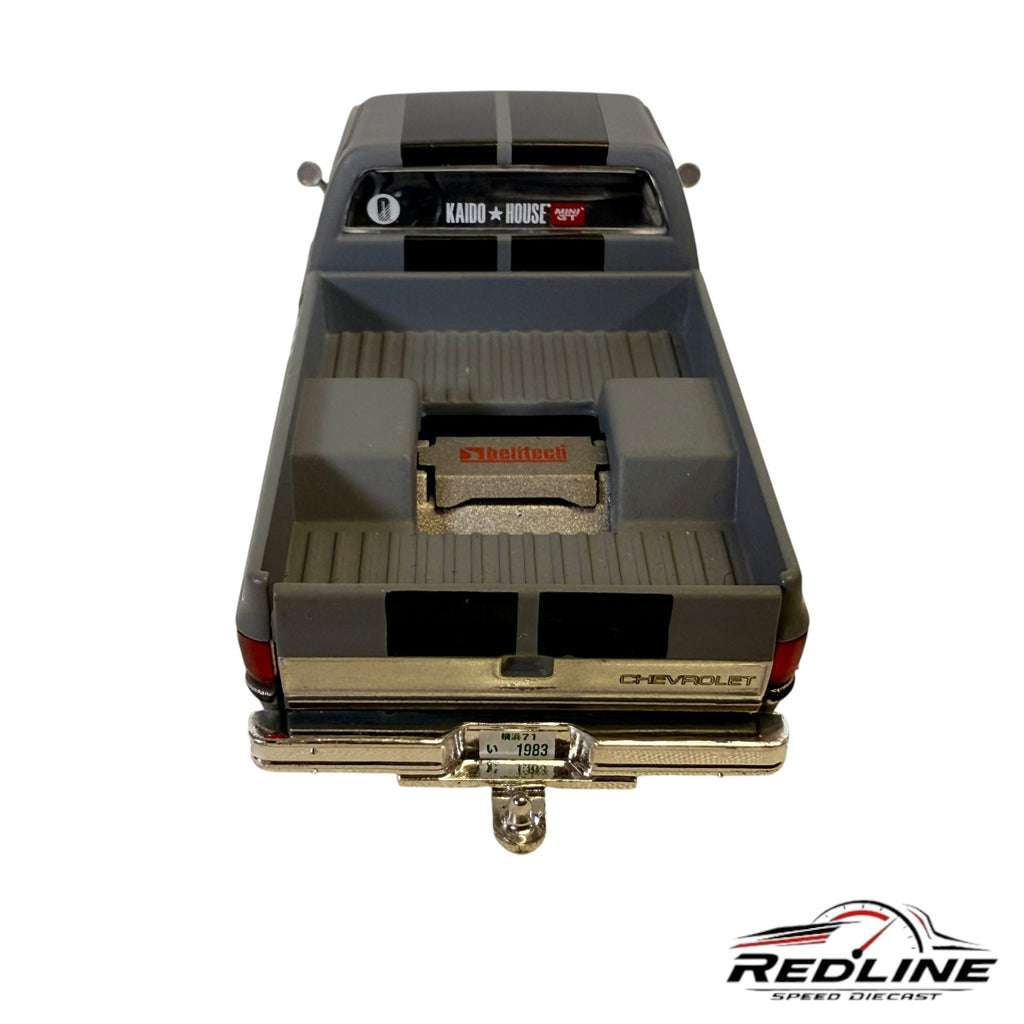 Redline Speed Diecast KAIDO HOUSE Chevrolet Silverado matte grey truck bed view with Beltech branding and racing stripes