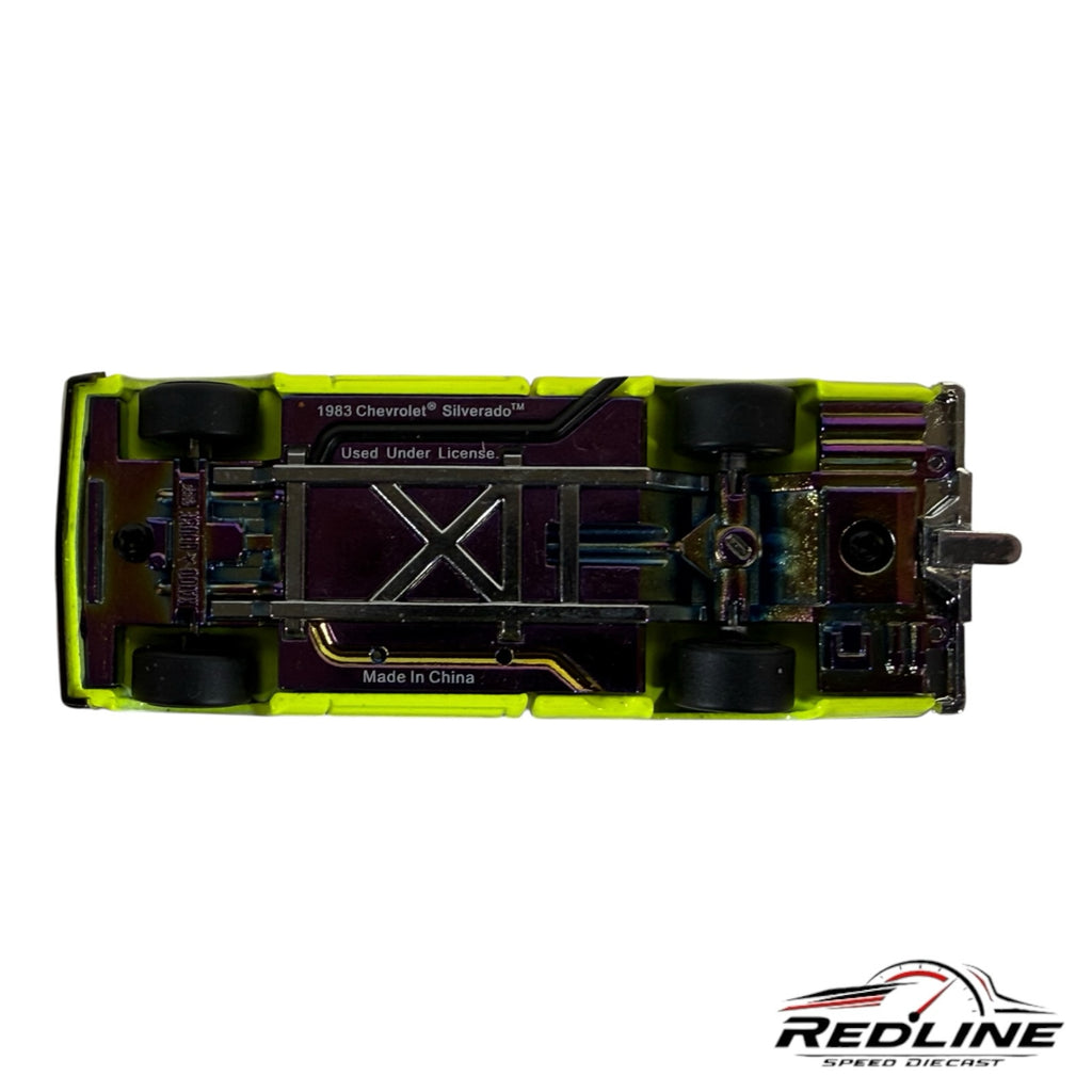 Redline Speed Diecast 1:64 scale Chevrolet Silverado showing the iridescent undercarriage and lowered chassis.