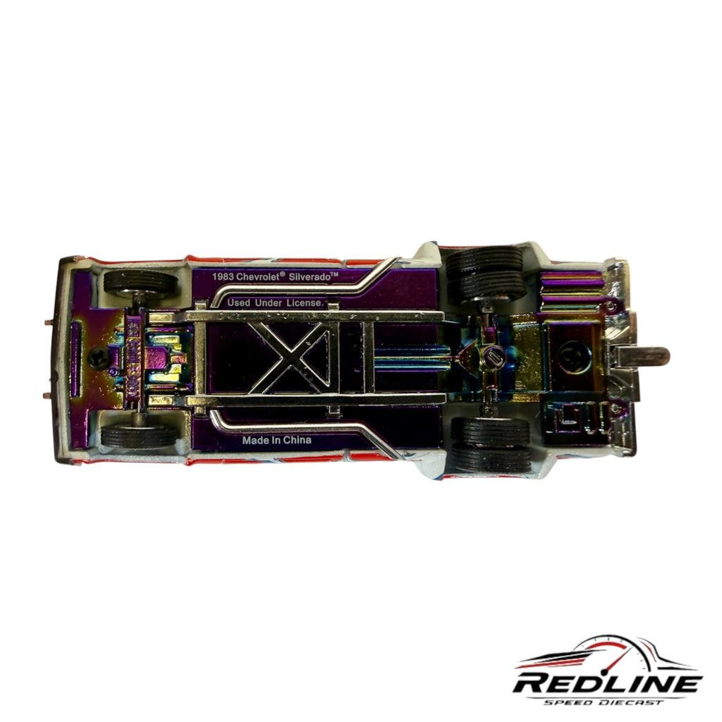 Underside view of Redline Speed Diecast 1983 Chevrolet Silverado Dually model with iridescent chassis finish