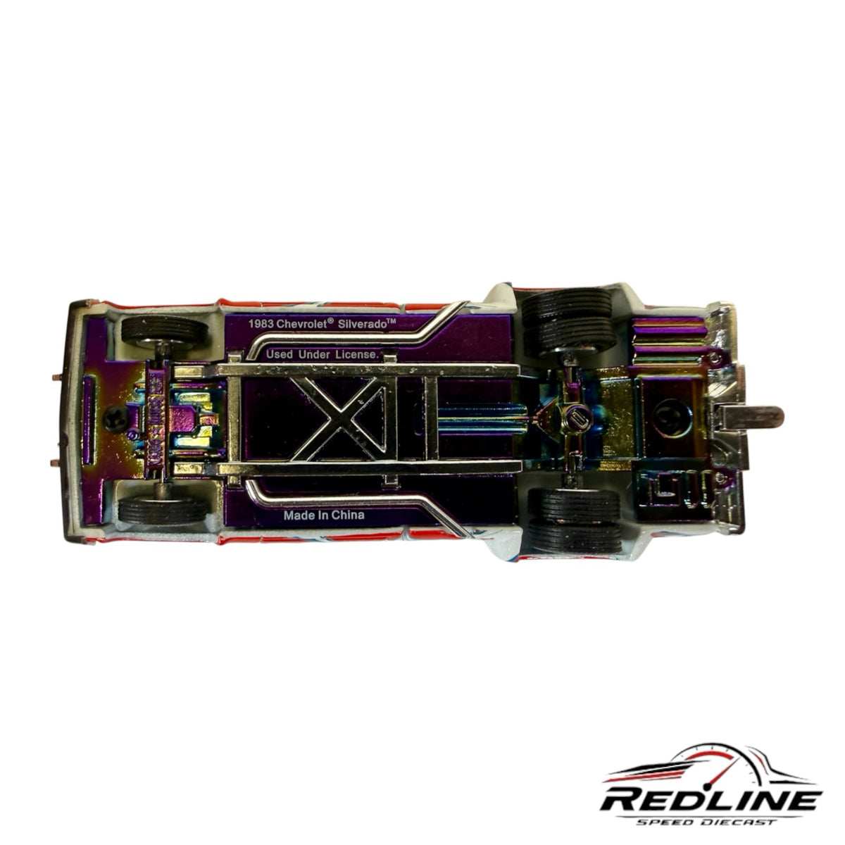 Underside view of Redline Speed Diecast 1983 Chevrolet Silverado Dually model with iridescent chassis finish