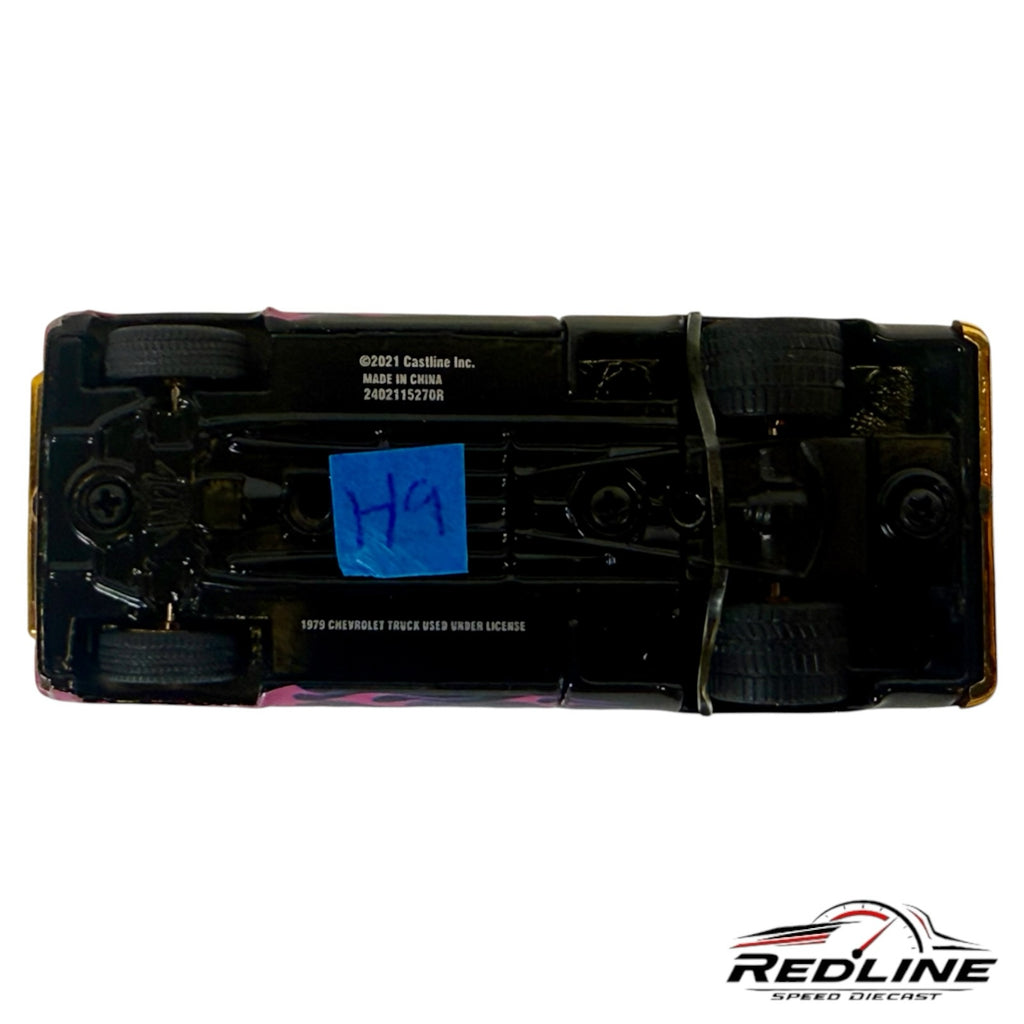 Underside view of a Redline Speed Diecast 1979 Chevrolet C10 custom pickup truck model showing chassis details