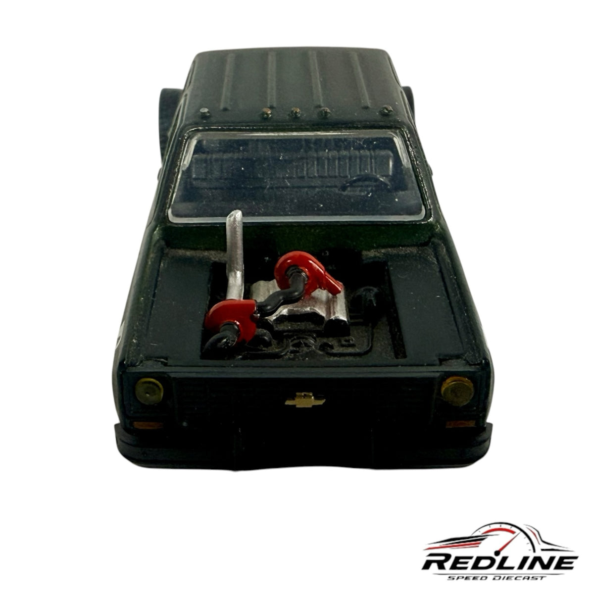 Redline Speed Diecast custom dark green square body pickup truck model with an exposed engine and red components.