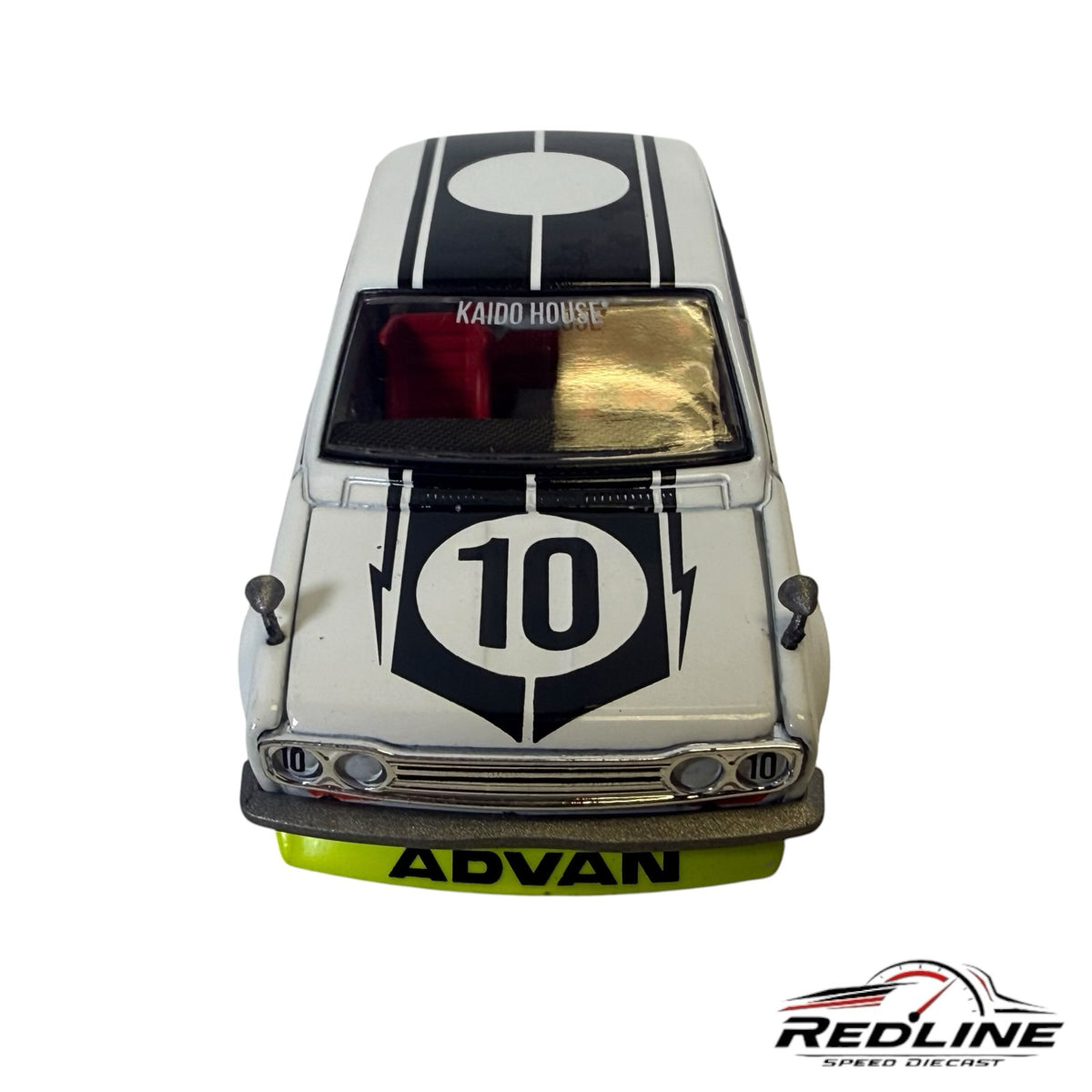 Redline Speed Diecast Kaido House Datsun 510 model car in white with black racing stripes and lime-green splitter.