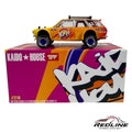 Redline Speed Diecast Kaido House Datsun 510 Wagon 4x4 model in yellow and orange with off-road tires and roof rack.