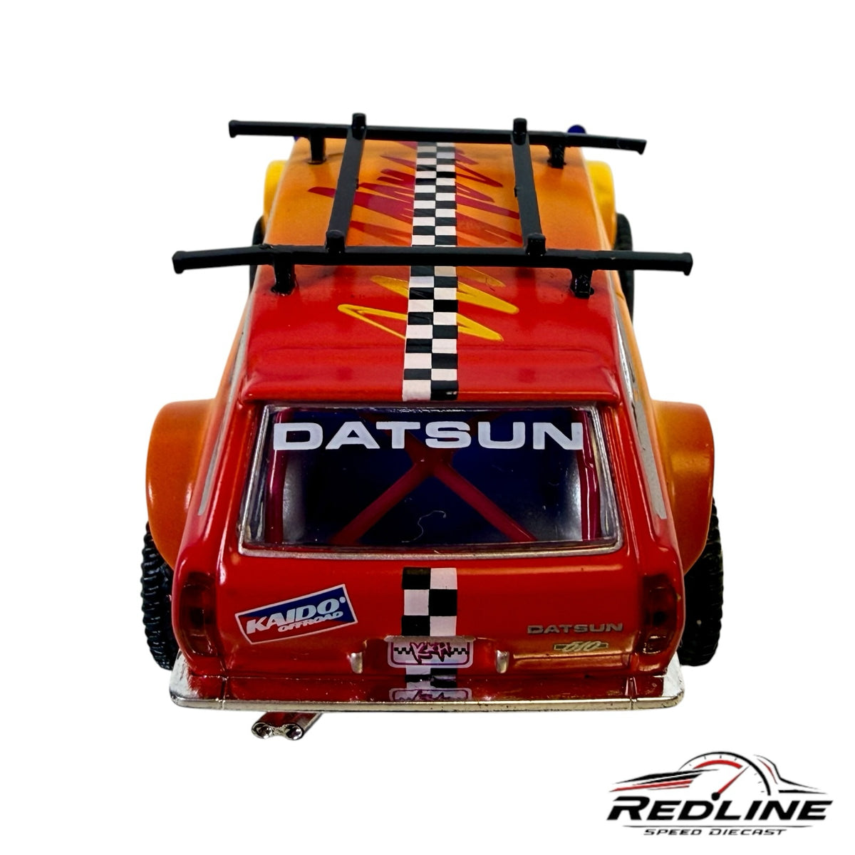 Redline Speed Diecast KAIDO HOUSE Datsun 510 Wagon 4x4 with orange-yellow gradient, roof rack, and checkerboard stripe