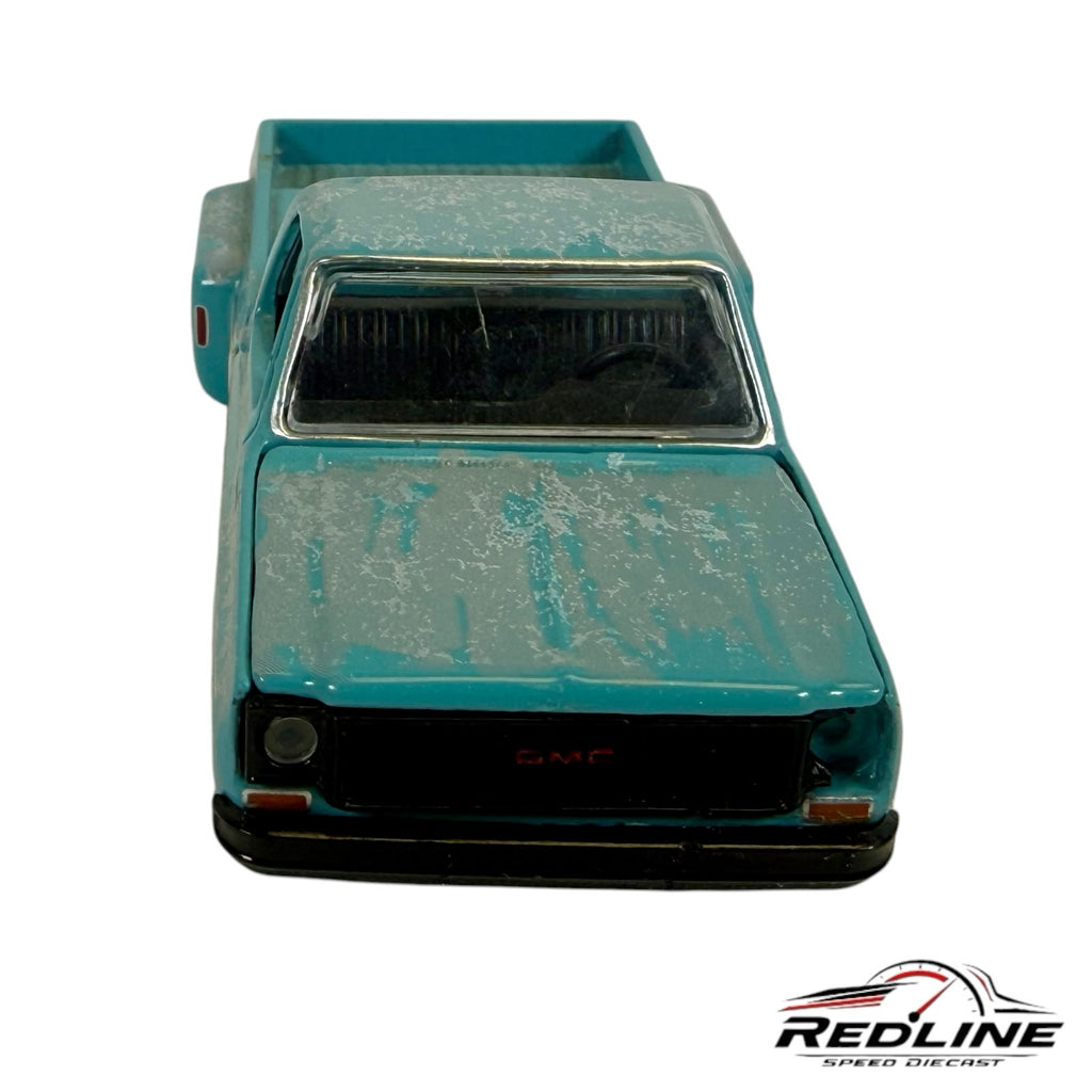 Redline Speed Diecast vintage teal and white distressed GMC pickup truck model, front view