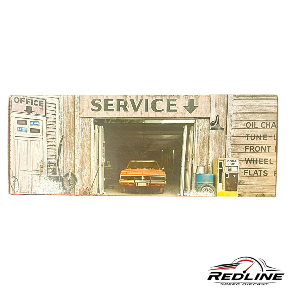 Redline Speed Diecast 1969 Dodge Charger R/T model in a garage-themed display box with vintage service station art.