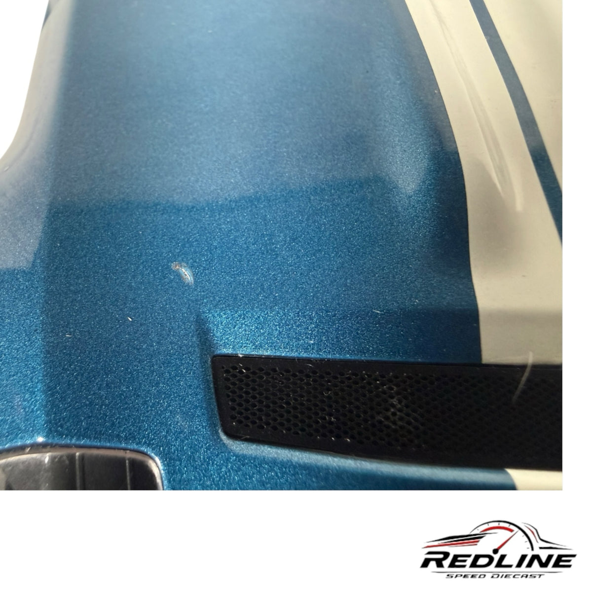 Redline Speed Diecast AUTOart Ford Shelby GR-1 model hood showing metallic blue paint and white racing stripe detail