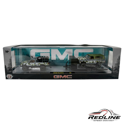 Redline Speed Diecast M2 Machines GMC set with a camouflage 1998 Sierra 1500, 1973 Jimmy, and a towing trailer.