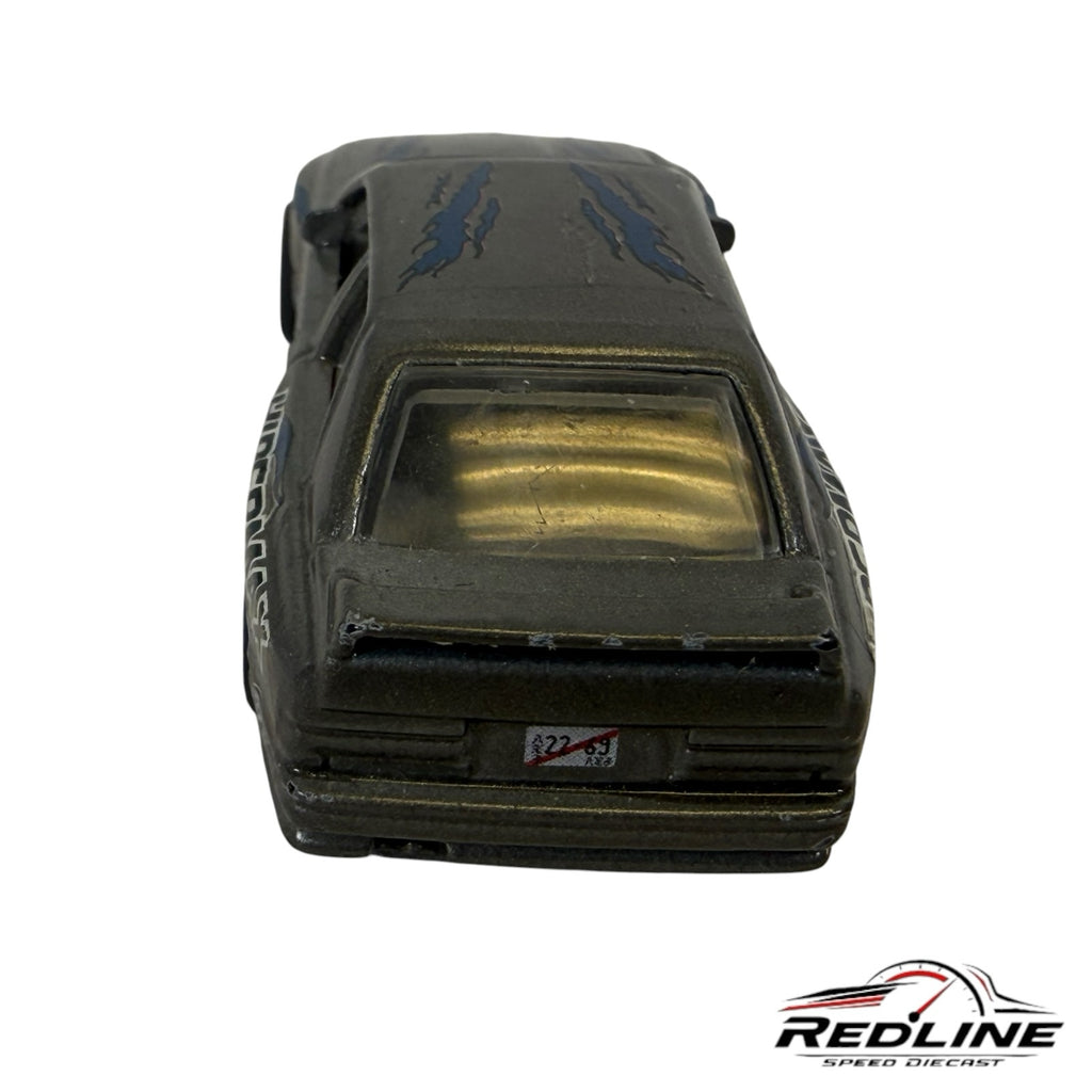 Rear view of a Redline Speed Diecast metallic grey BMW E30 M3 tuner model with blue flame decals and rear spoiler.