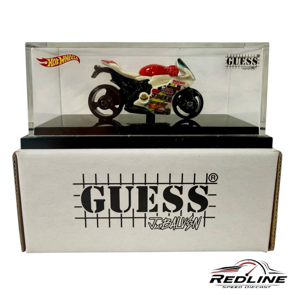 Redline Speed Diecast Hot Wheels GUESS J Balvin Ducati motorcycle model in a clear acrylic display case with box.