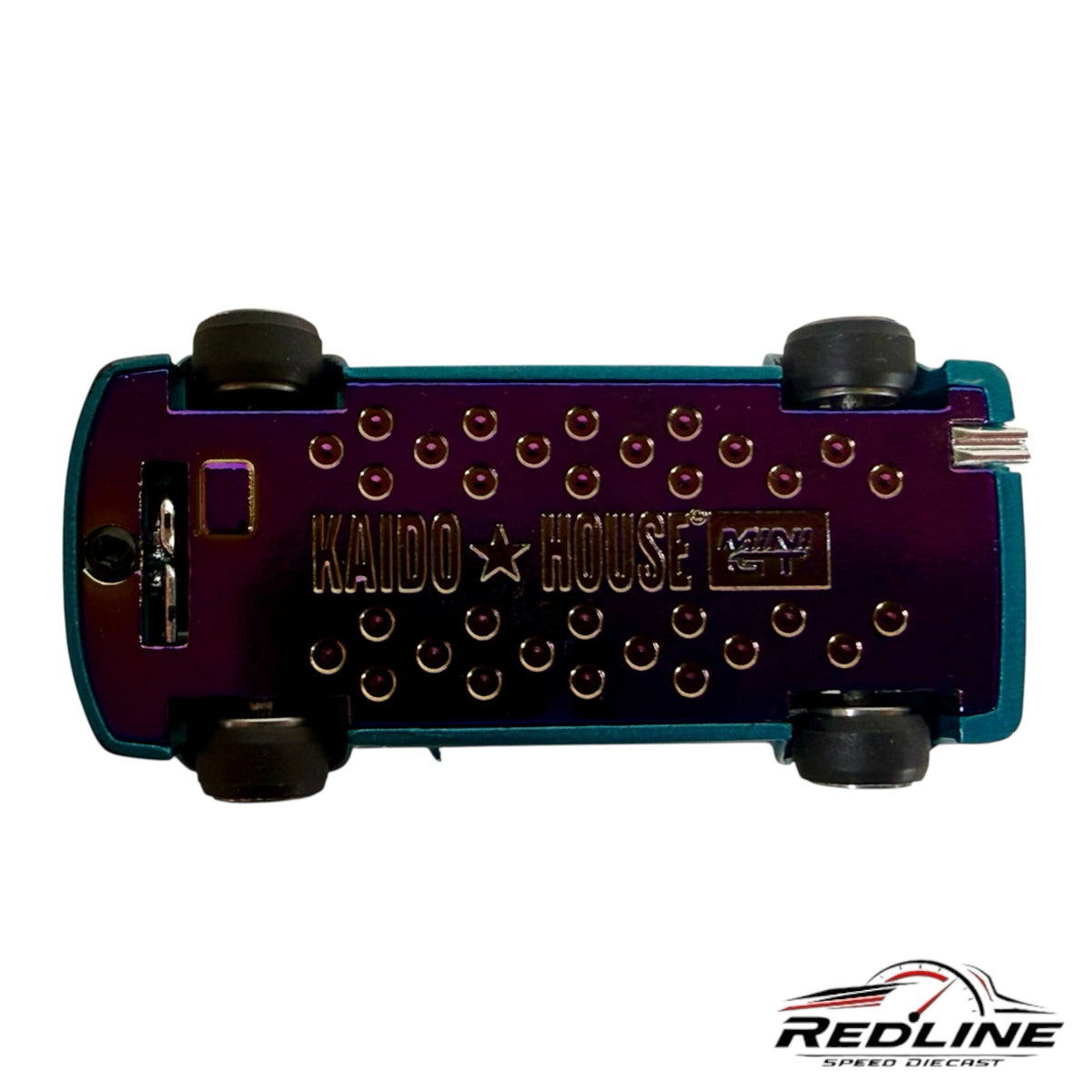 Underside of Redline Speed Diecast Honda Civic Kaido House model showing purple metal chassis and rubber tires