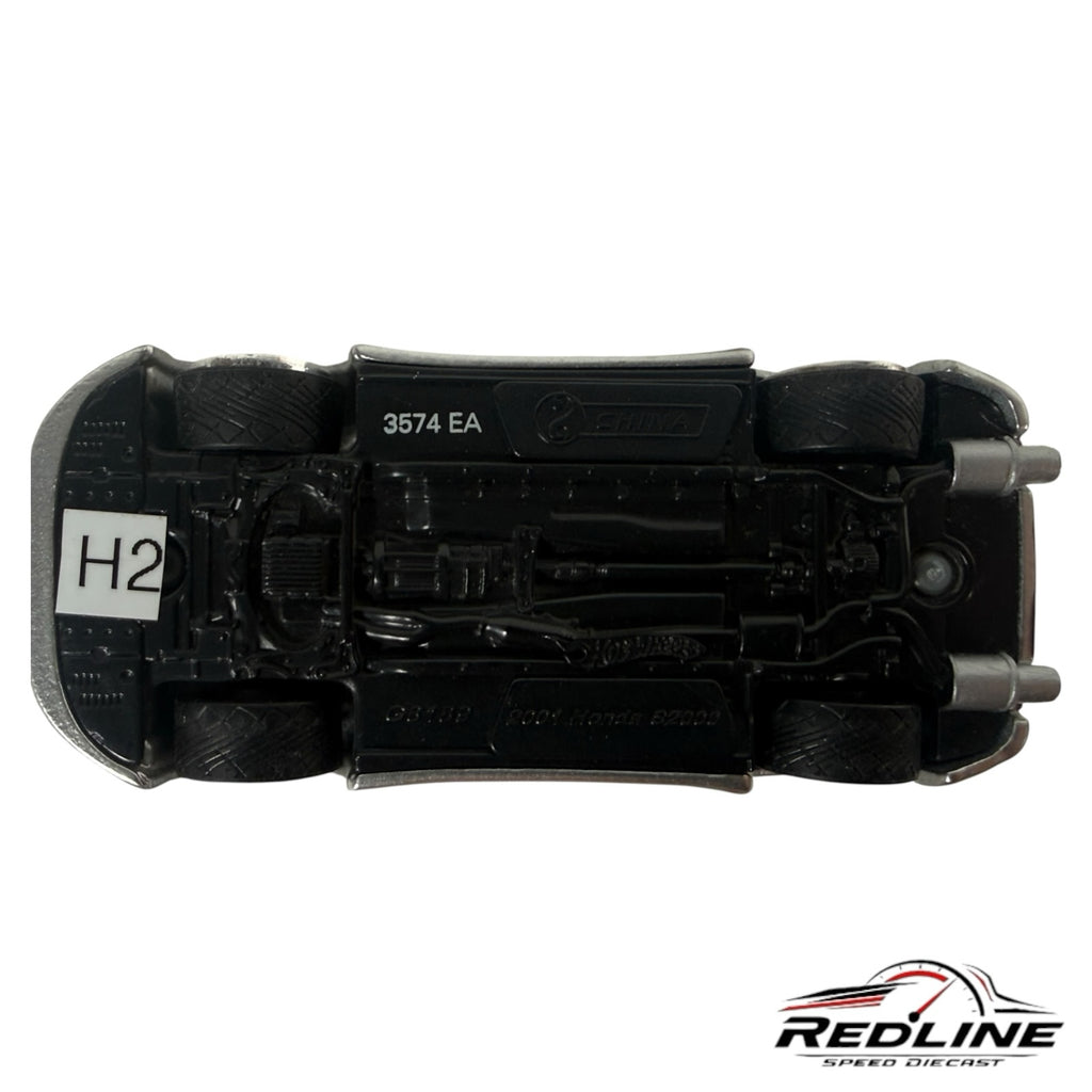 Underside view of a Redline Speed Diecast Honda S2000 model car showing chassis details and black tires