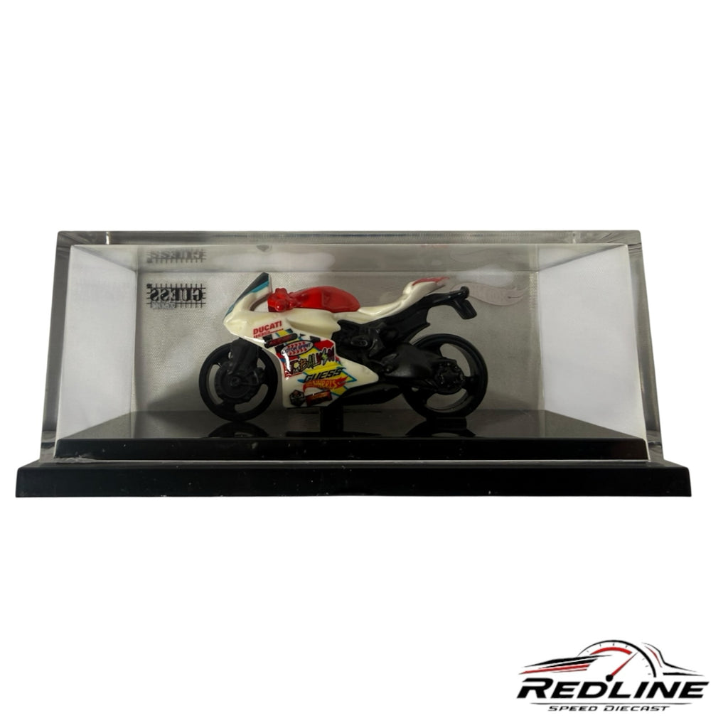 Redline Speed Diecast Hot Wheels GUESS J Balvin Ducati motorcycle model in a clear acrylic display case.