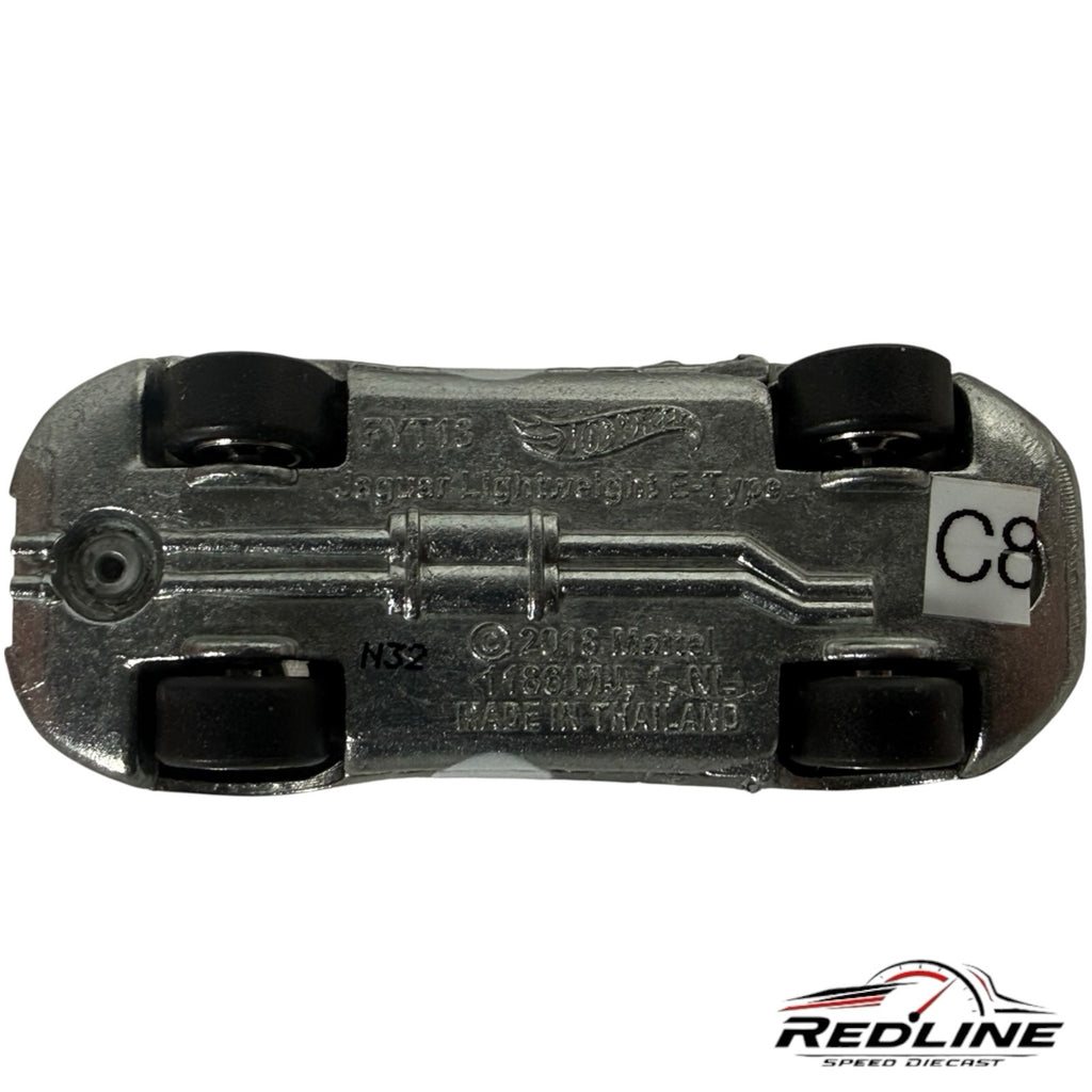Underside view of a Redline Speed Diecast silver Jaguar Lightweight E-Type model car showing chassis details