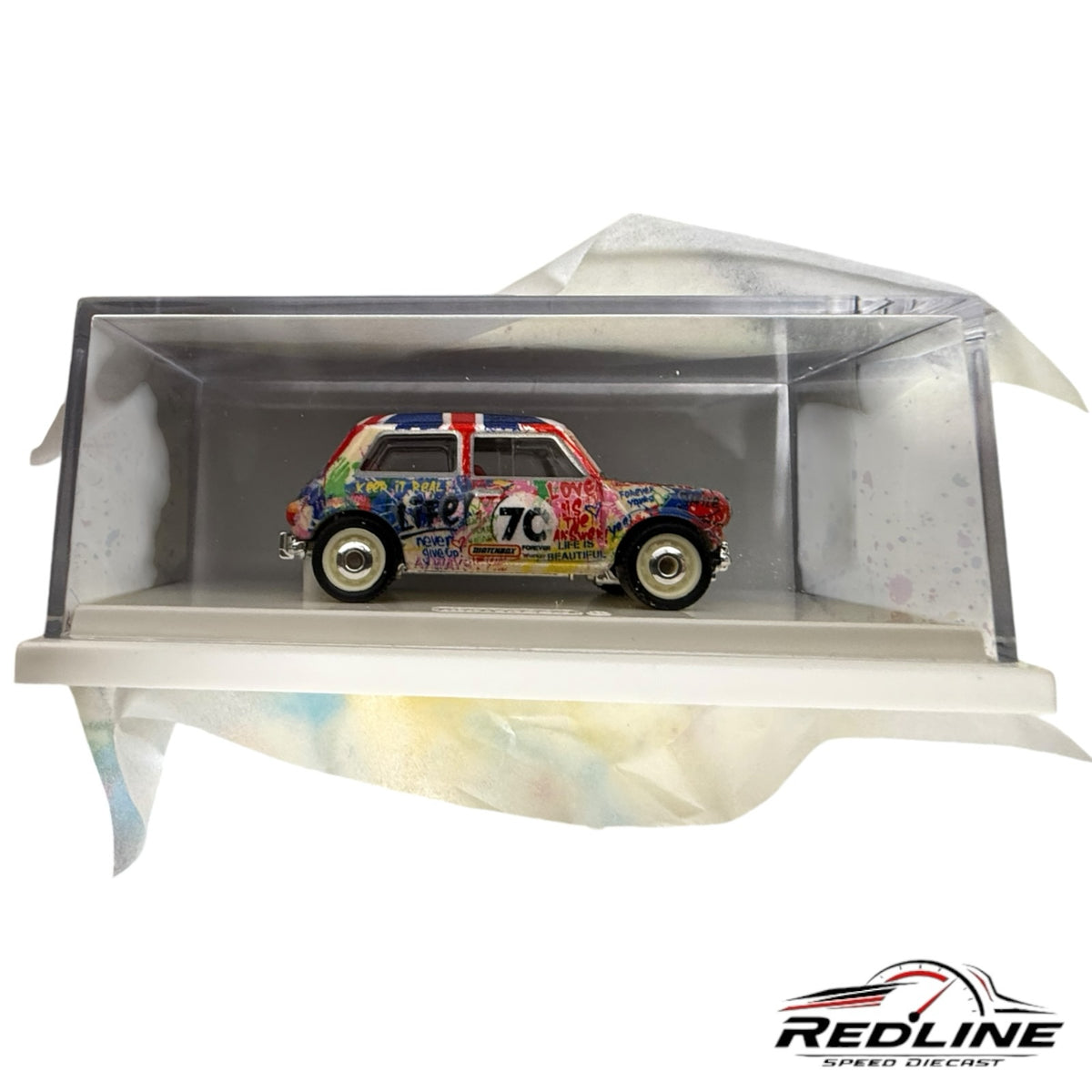 Redline Speed Diecast Matchbox Mr. Brainwash Austin Mini Cooper S with graffiti art and Union Jack roof in display case