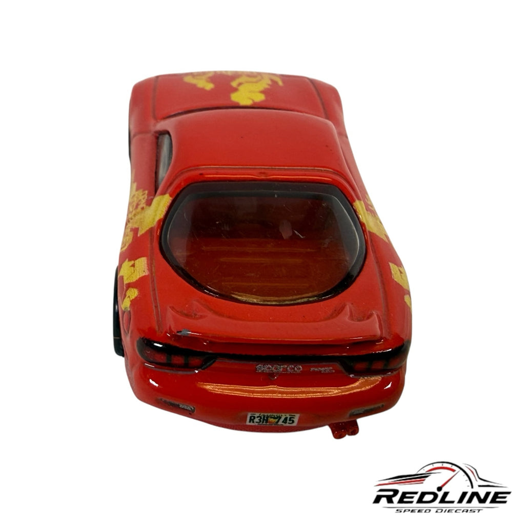 Redline Speed Diecast 1995 Mazda RX-7 die-cast model in red with yellow racing decals and rear spoiler, rear view