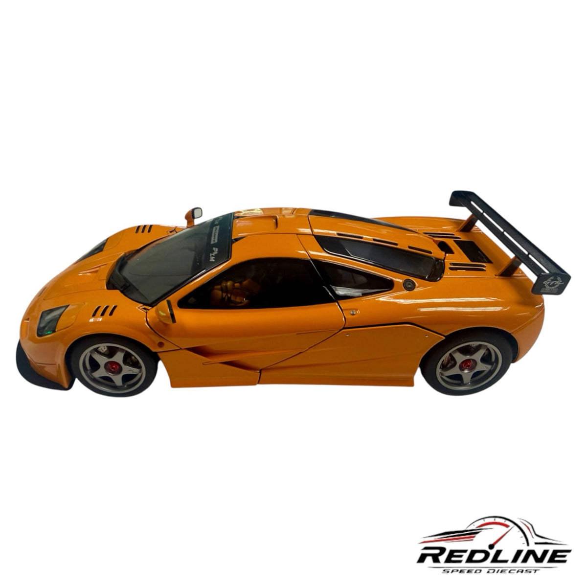 Redline Speed Diecast 1:18 scale McLaren F1 LM model car in vibrant orange with rear wing and detailed body lines