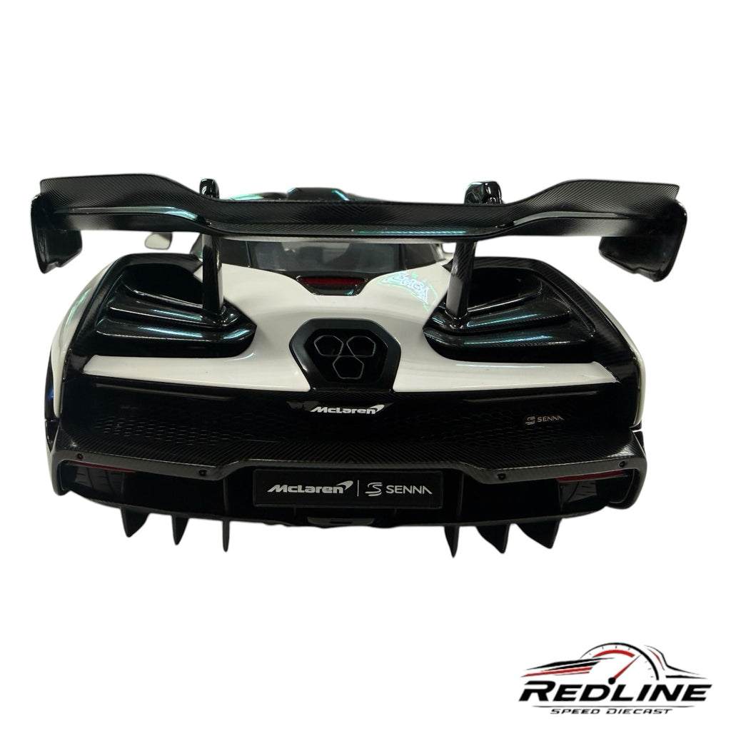 Redline Speed Diecast McLaren Senna model car rear view featuring white bodywork, carbon fiber wing, and diffuser.