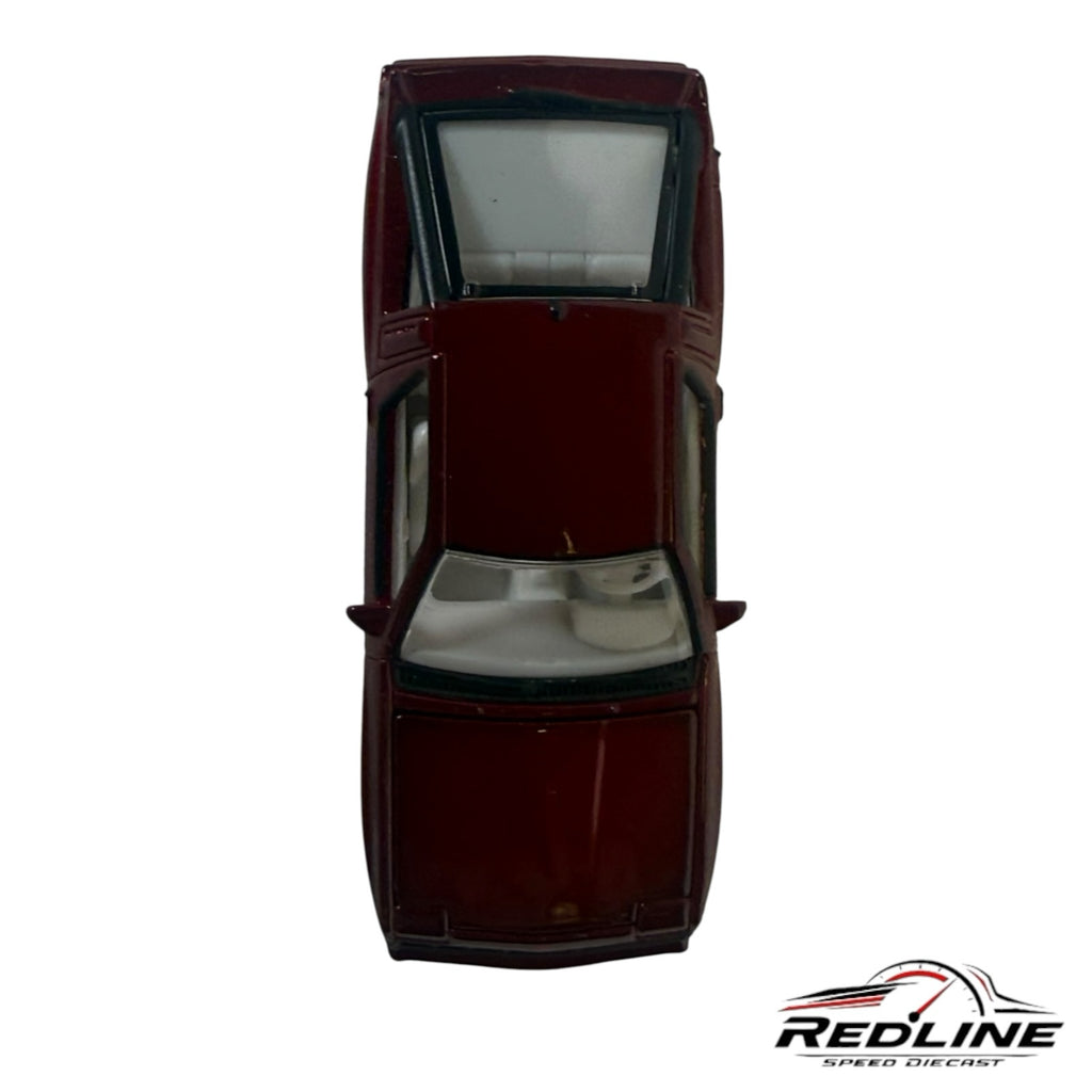 Redline Speed Diecast 1:64 scale metallic maroon Mitsubishi Starion sports car model, top-down view with white interior.