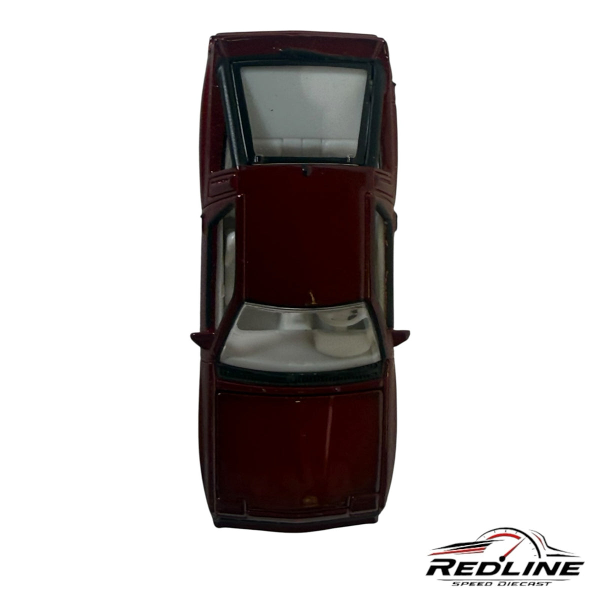 Redline Speed Diecast 1:64 scale metallic maroon Mitsubishi Starion sports car model, top-down view with white interior.