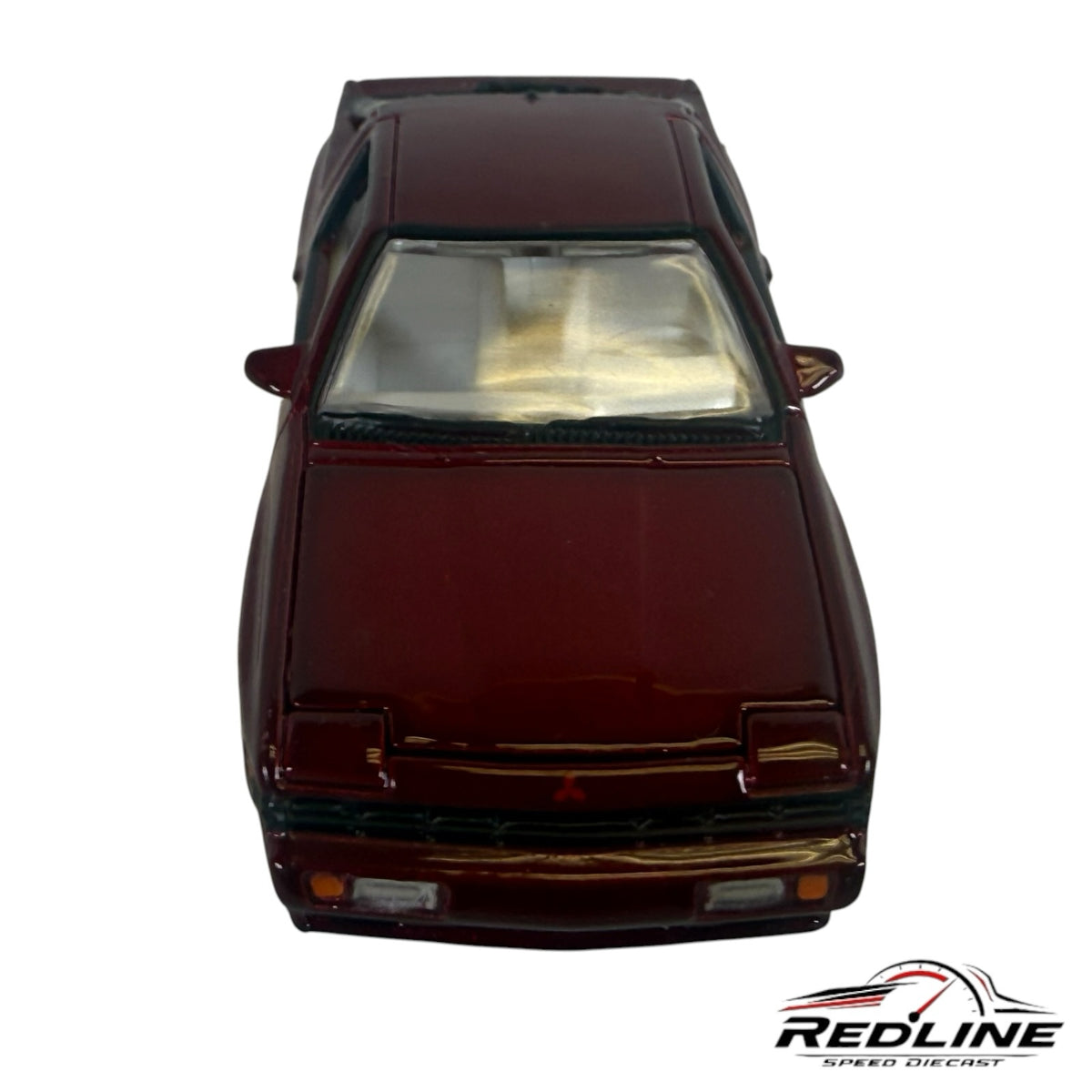 Redline Speed Diecast 1:64 scale metallic maroon Mitsubishi Starion model car, front view showing wedge silhouette.