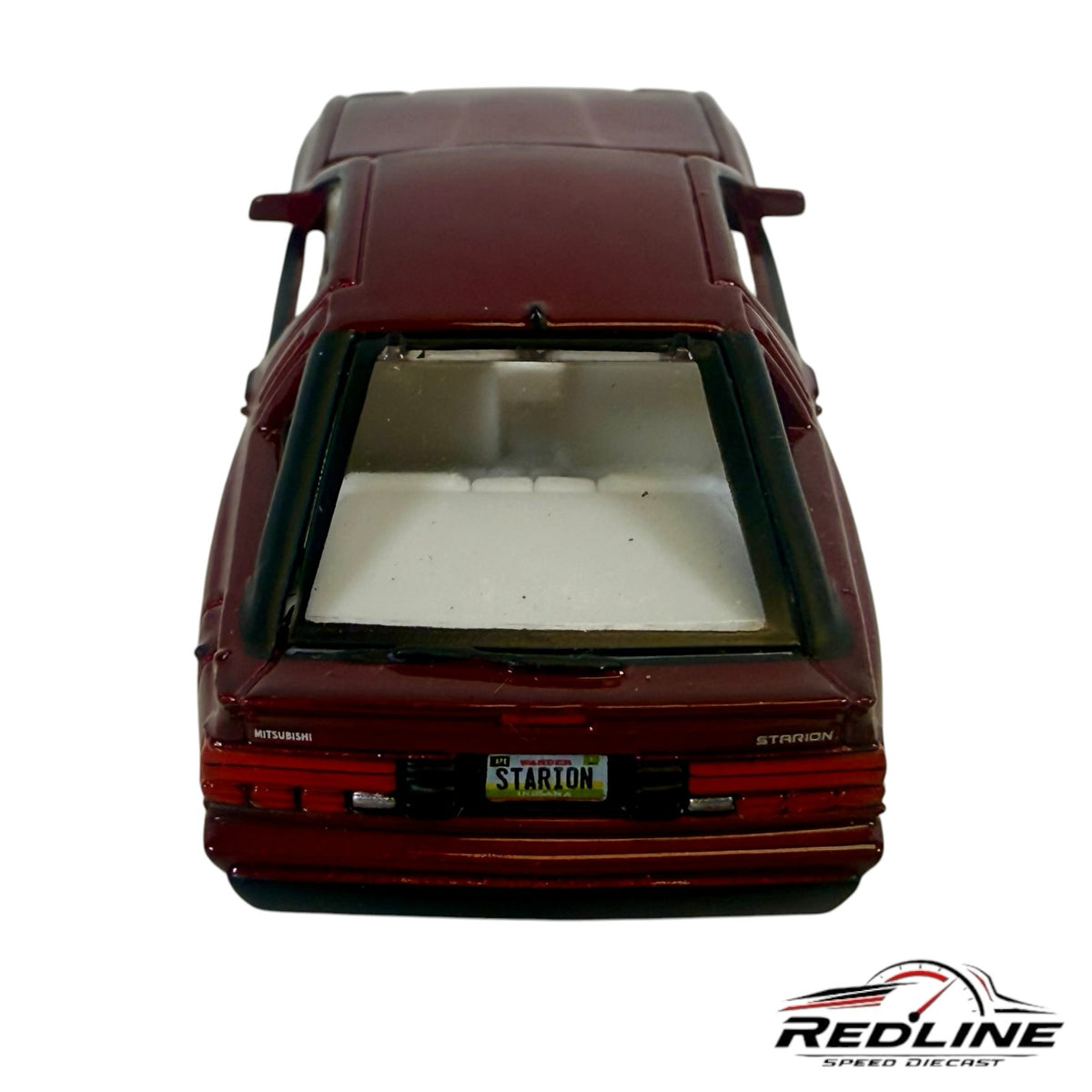 Redline Speed Diecast 1:64 scale metallic maroon Mitsubishi Starion sports car model, rear view with white interior.