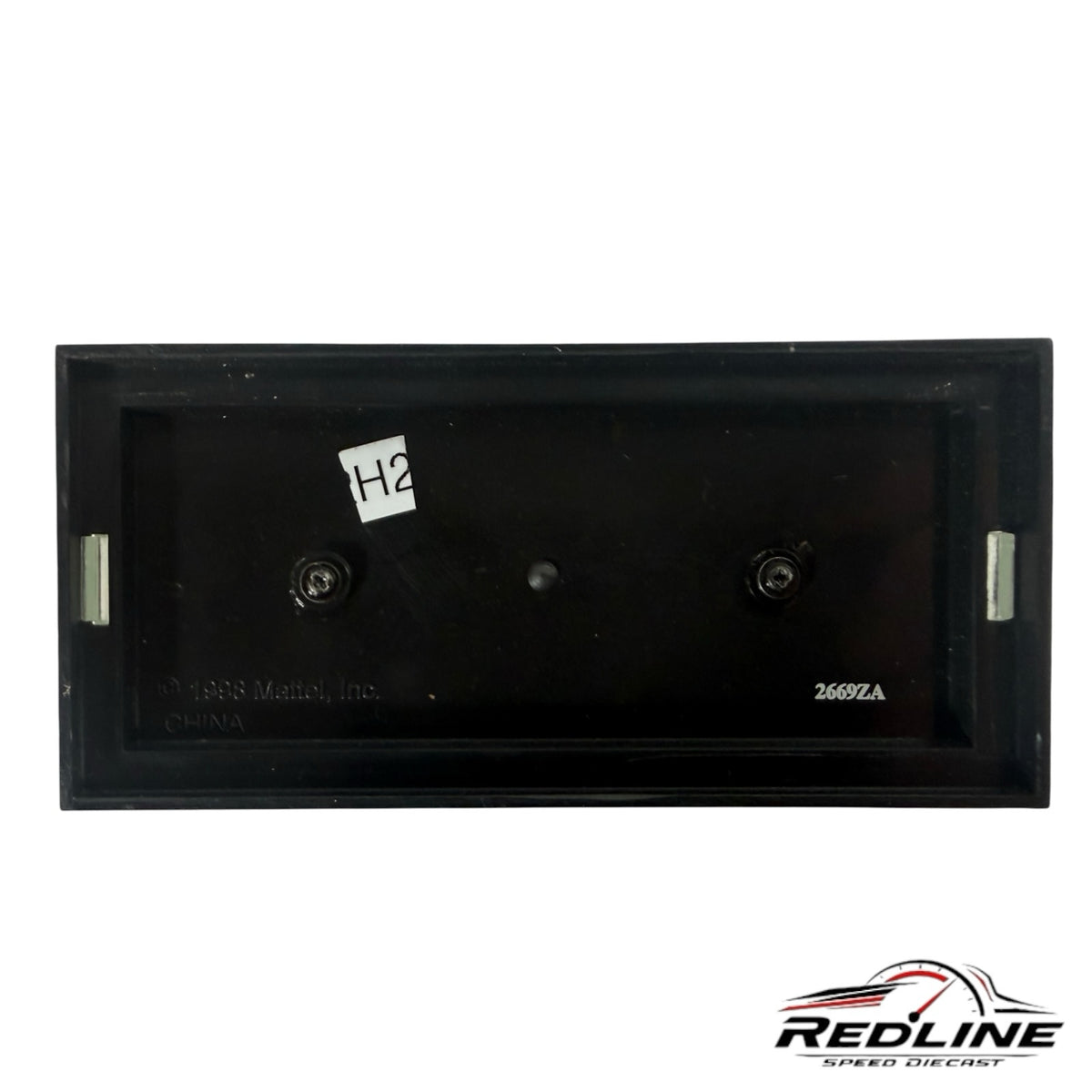 The black plastic display base for a Redline Speed Diecast vintage pickup truck model with mounting screws.
