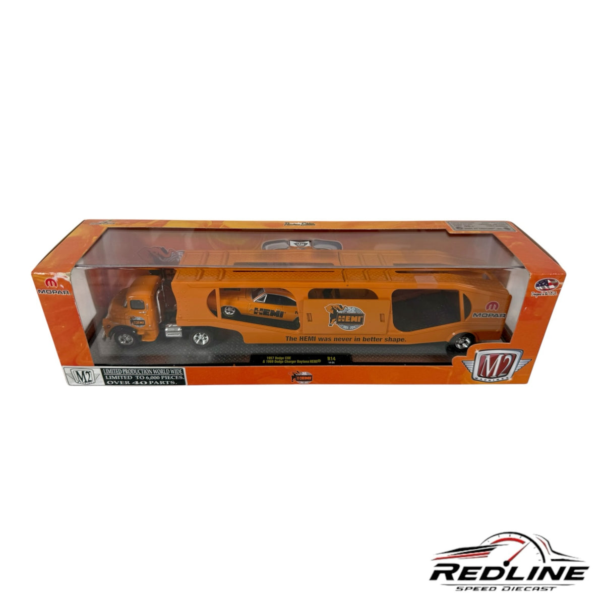 Redline Speed Diecast M2 Machines Mopar orange auto hauler set with a 1:64 scale truck and trailer in display box.