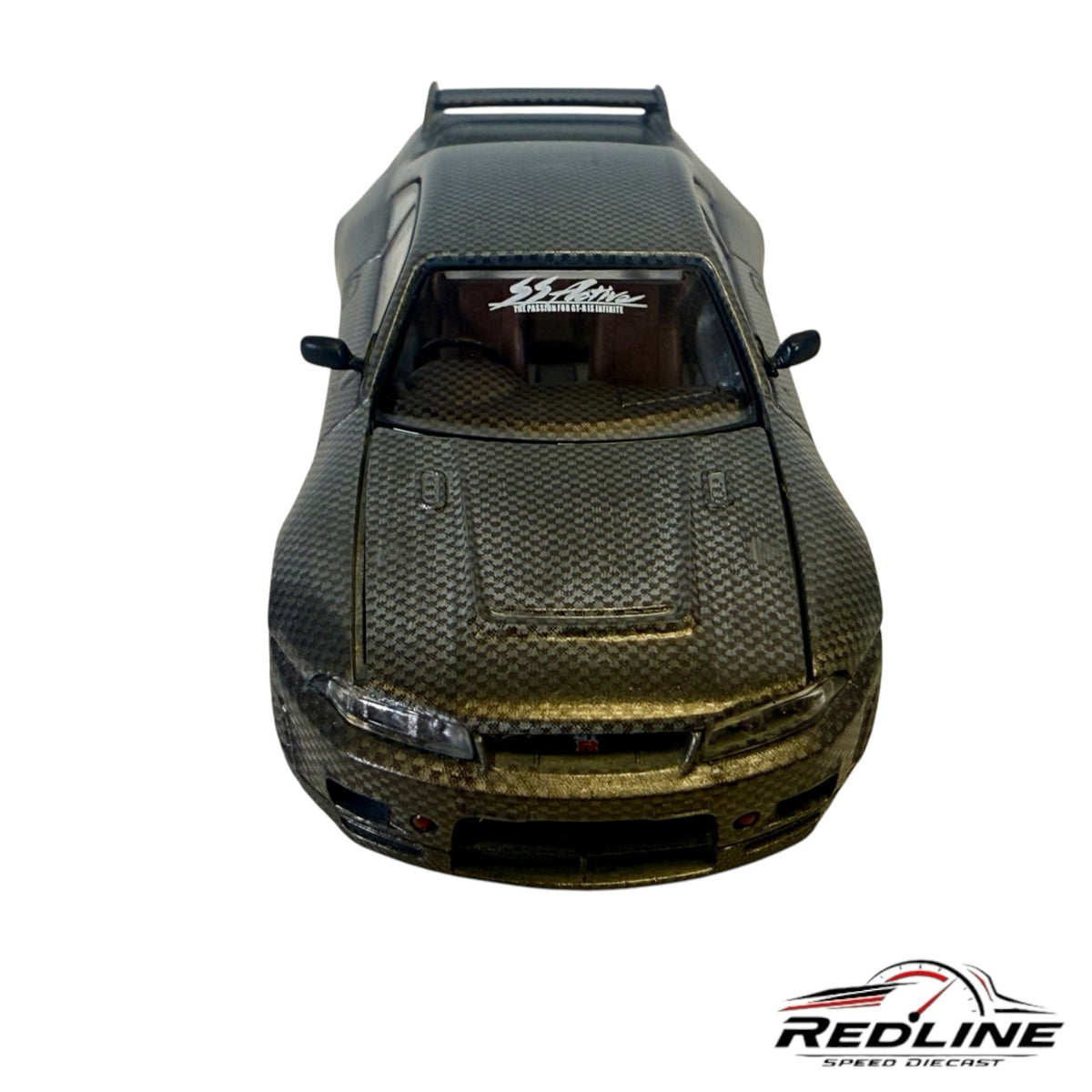 Redline Speed Diecast Nissan Skyline GT-R R33 model with a detailed carbon fiber finish and racing decals