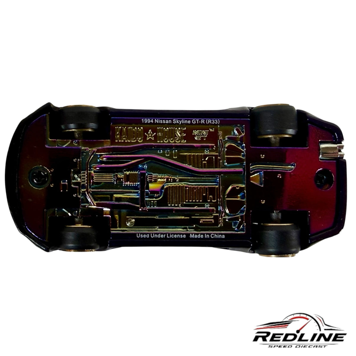 Redline Speed Diecast 1:64 scale Nissan Skyline GT-R R33 model car showing the iridescent chassis and detailed base.